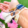 woven tassel bracelet with gold star studs